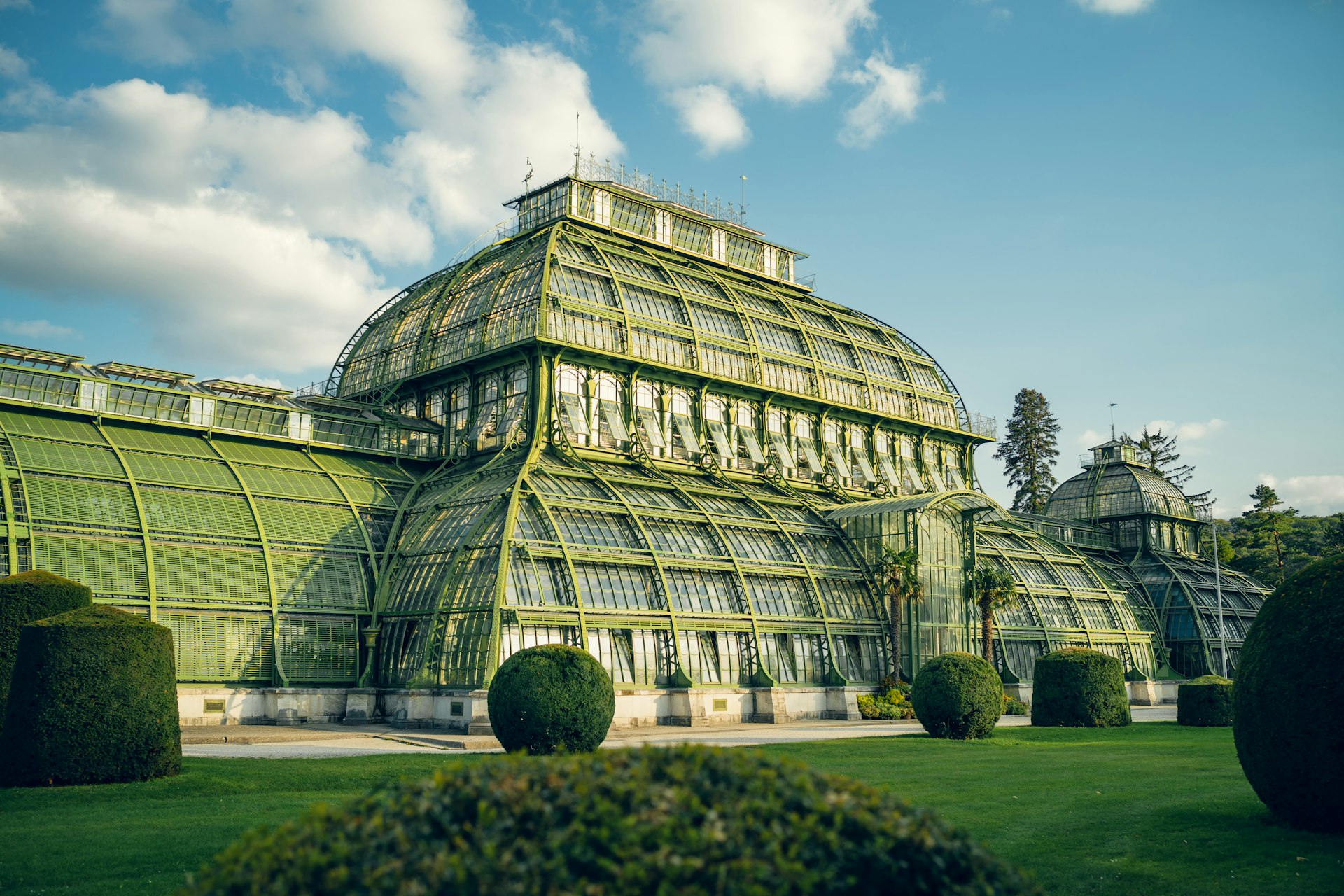 A large green building with a lot of windows